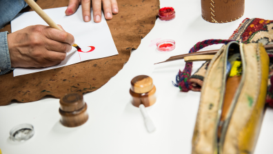 Someone draws during a calligraphy workshop