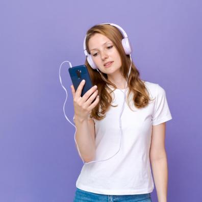 Portrait of a young woman wearing headphones