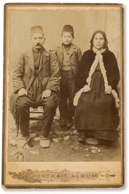 A portrait photo of a family in traditional dress