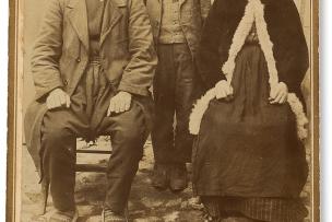 A portrait photo of a family in traditional dress