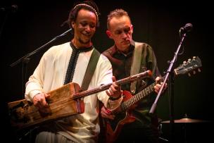 Justin Adams and Mohamed Errebbaa on stage